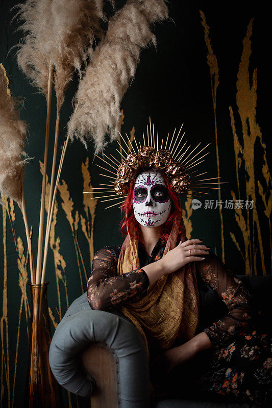 Portrait of young woman with Sugar skull